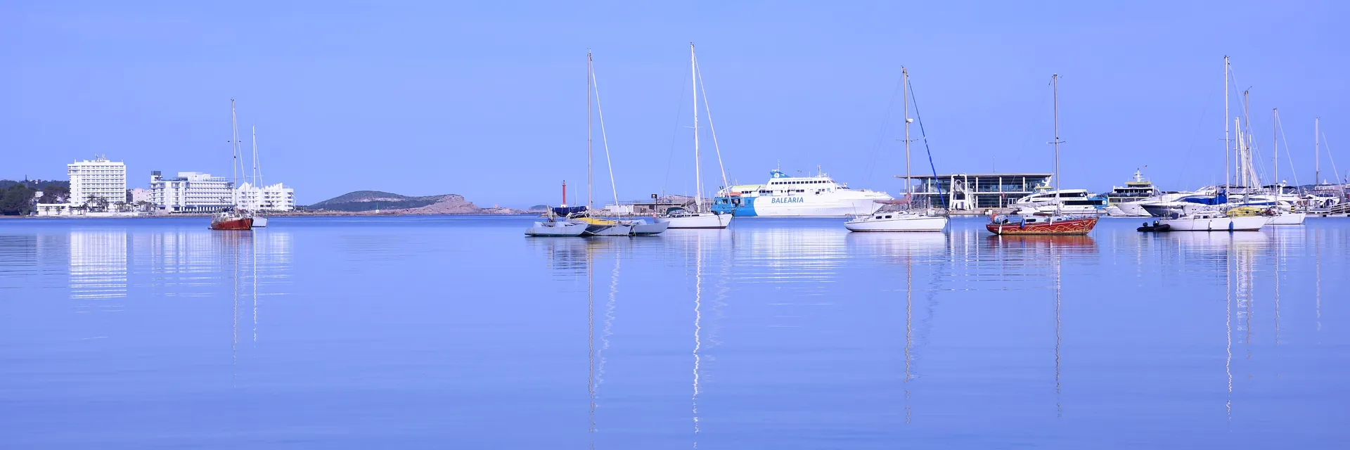 Boats anchored in a calm bay at San Antonio, Ibiza